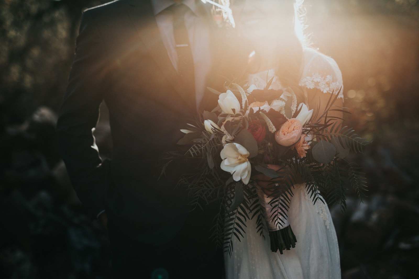 Newlyweds celebrating outdoors with their guests